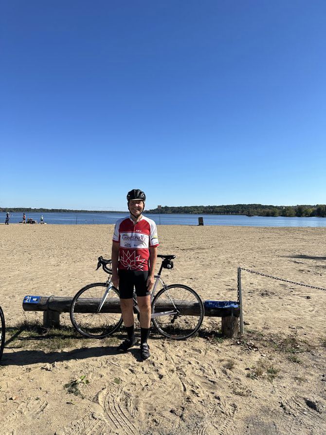 Dragonfly sitting on knee for a long time at Petrie Island Beach after a gorgeous ride